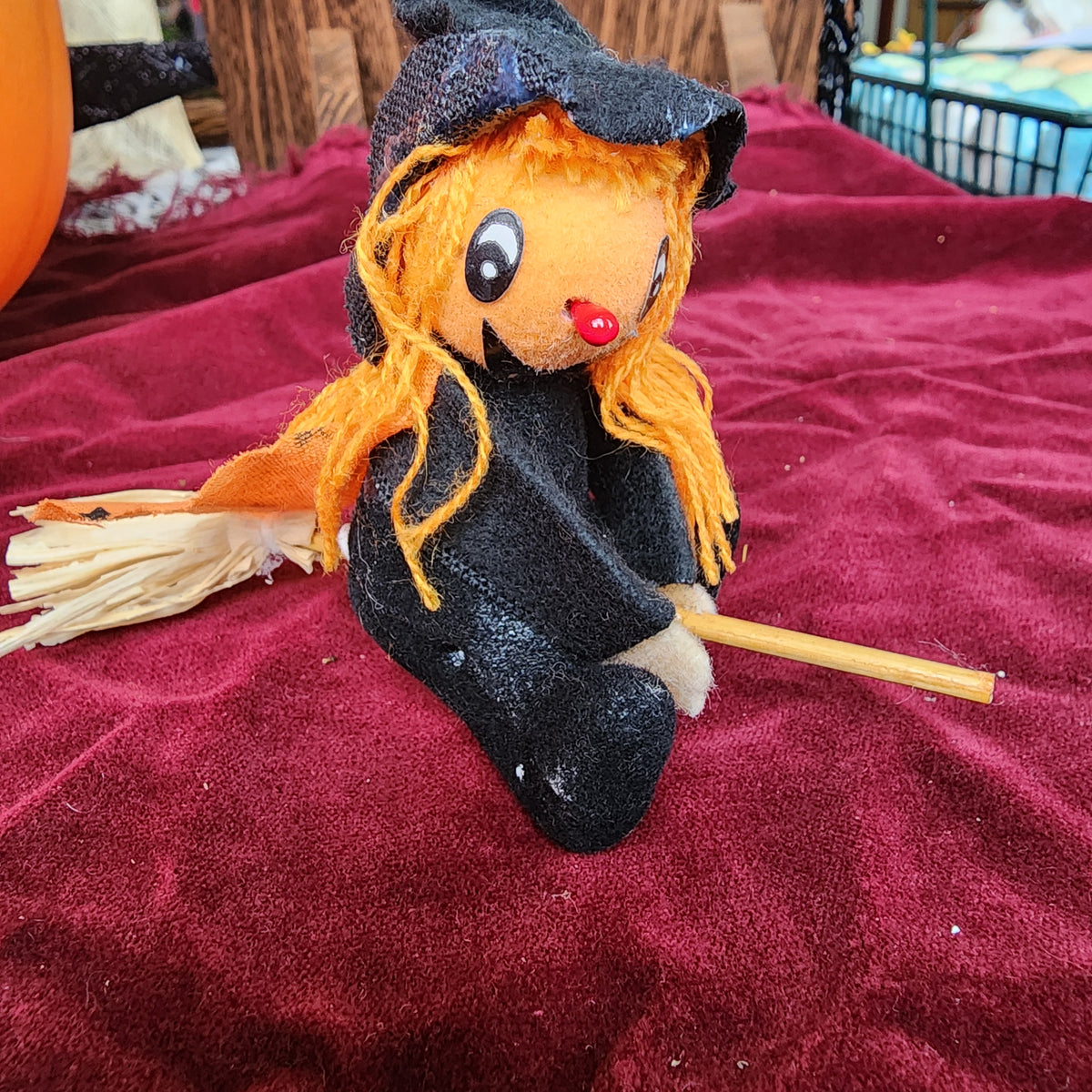 Little pumpkin witch on a broom